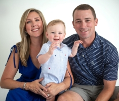 Sisler with her husband and son in July 2023.